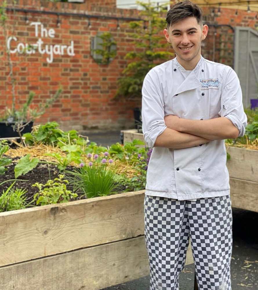 A chef in the Courtyard at The George